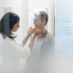 A female doctor checks on a female patient